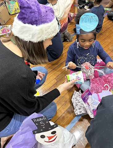 Natixis Investment Managers celebrated its 10-year partnership with the Winthrop Elementary School during the firm's annual "Frosty's Friends" holiday gift-giving event. (Photo: Business Wire)