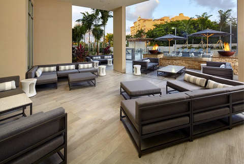 Unwind on the outdoor patio, outfitted with fire pits and comfortable lounge seating. (Photo: Business Wire)