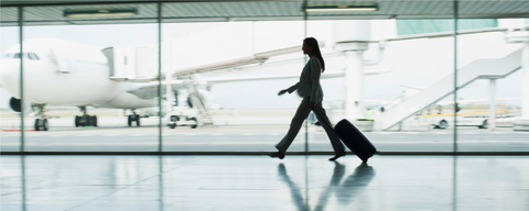 original Passenger walks through an airport terminal on the way to catch a flight. Cirium, the aviation analytics company, has published its 2022 On-Time Performance rankings, looking at the top performing airlines and airports worldwide. The definitive, world-leading analysis recognises excellence in punctuality by the aviation industry globally. (Photo: Business Wire)