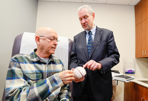 Yehuda Haber (left) speaks with Dr. Michael Schulder about the Alpheus Medical ultrasound clinical trial. (Credit: Feinstein Institutes)