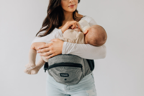 Tushbaby can also be used to breast and bottle feed, taking the weight off the shoulders, back and arms. The carrier can hold up to 45 lbs and be used to carry infants to toddlers in different positions. (Photo: Business Wire)