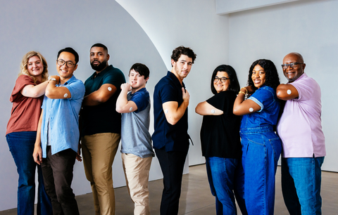 Dexcom Warriors join Nick Jonas on set for a behind-the-scenes look at the production of Dexcom's 2023 Super Bowl commercial launching its new Dexcom G7 CGM System. From left to right: Krista S., Joshua V., Donn K., Trevor G., Nick Jonas, Mireya M., Kesha C., Earl G. (Photo: Business Wire)