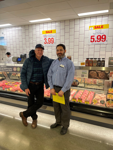 Local Niman Ranch hog farmer Tom Arnold meets with the meat manager of Mariano's Lombard location. Tom Arnold and his family have raised pigs humanely and sustainably for Niman Ranch for over 20 years on their farm in Elizabeth, Illinois. All Niman Ranch farms are Certified Humane and prohibit the use of antibiotics and crates. (Photo: Business Wire)