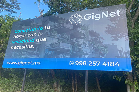 Photo Source GigNet: GigNet Fiber-to-the-Home Billboard, Tulum, Mexico; Translation: “Connecting Your Home With The Speed You Need”