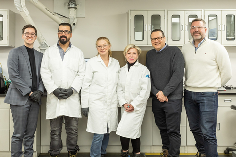 Québec Minister Caroline Proulx and President & CEO Eric Desaulniers pose with members of NMG’s R&D team at the Company’s Phase-1 facilities during the announcement of the financial levers.(Photo: Business Wire)