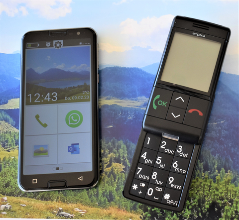 Twenty-year difference. On the left, the new emporiaSMART.5 with triple camera, octa-core processor, NFC, Whatsapp, etc. On the right, the world’s first push-button cell phone for seniors with a slide-on keypad. Both feature the life-saving emergency button on the back. Photo: emporia