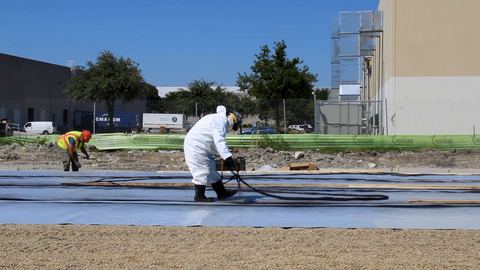 A Land Science® Certified applicator spraying Nitra-Core™ as part of the installation of the MonoShield® contaminant vapor barrier system. (Photo: Business Wire)