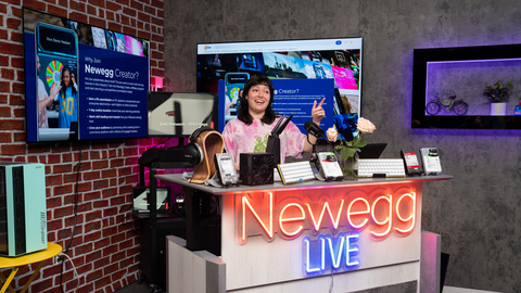 Tori Vasquez shows tech products on Newegg's livestream set. (credit: Newegg)