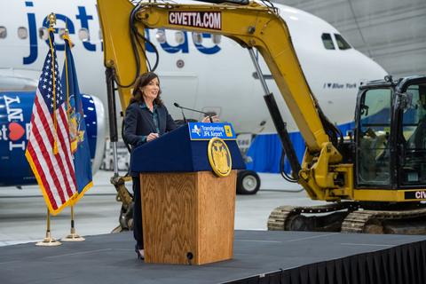 New York Governor Kathy Hochul speaks at Terminal 6 groundbreaking inside JetBlue's JFK hangar. (Photo courtesy: Office of the Governor of New York)