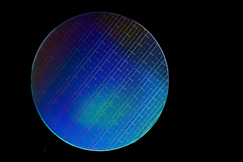 A photo shows Intel’s fully processed 300-millimeter silicon spin qubit wafer. (Credit: Intel Corporation)
