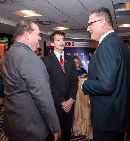 Owen and his dad Brian catch up with Howie Long ahead of the 2023 Legends for Charity dinner. (Photo: Business Wire)