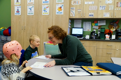 Anita Haas, a dedicated teacher at Franklin Center, works closely with two of her students, using an innovative approach to education that combines academic instruction with personalized therapy goals. (Photo: Business Wire)