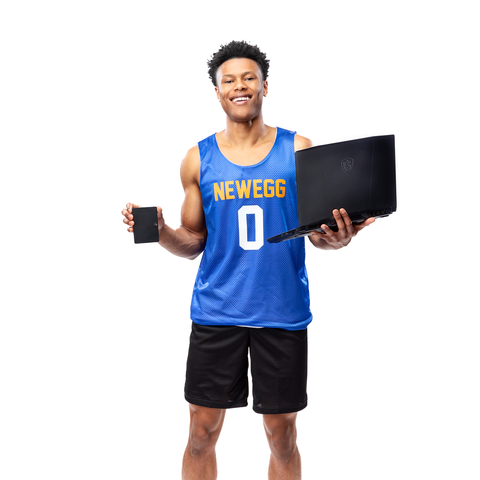 Jaylen Clark of the UCLA men's basketball team and the Pac-12 Defensive Player of the Year poses with (from left) a Seagate Expansion external hard drive and an MSI Katana 15 Gaming Laptop as part of an NIL endorsement with Newegg, MSI and Seagate. The photo was taken on Feb. 21. (credit: Newegg)