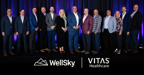 Pictured from left: WellSky’s SVP Operations Dan Weaver, Chief Analytics Officer & WellSky Home General Manager Wes Little, Chief Clinical Officer Tim Ashe, SVP Professional Services Mike James, COO Steve Morgan, Director of Solution Management Kelly Phillips, CEO Bill Miller with VITAS Healthcare’s President & CEO Nick Westfall, EVP & COO Joel Wherley, SVP Software Engineering & Senior Data Officer Julio Rodriguez Simon, VP Hospice Operations Belinda Hodge, SVP Innovation and Strategy Brandon Stock, and EVP & CIO Patrick Hale (Photo: Business Wire)