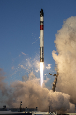 A Rocket Lab Electron launch vehicle lifts off from Launch Complex 1 before the first stage comes back to Earth for an ocean landing and recovery as part of Rocket Lab's reusability program. (Photo: Business Wire)