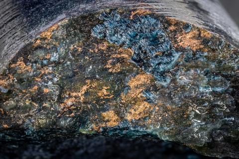 Figure 3. Photograph of drill core from QNI hole QDG-23-503 at 341.70 metres depth showing abundant native copper on a fracture plane within the serpentinized dunite unit. NQ core, long axis of photograph is approximately 2.5 cm. (Photo: Business Wire)