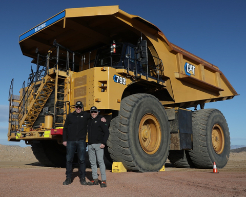 Eric Desaulniers, NMG President and CEO, and Bernard Perron, NMG COO, with Caterpillar’s first battery electric 793 large mining truck demonstrated at Caterpillar’s Tucson Proving Ground in Arizona. (Photo: Business Wire)