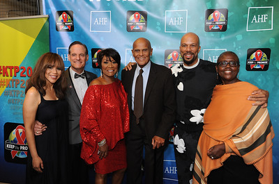 November 30, 2016: AIDS HEALTHCARE FOUNDATION - From left, Rosie Perez, AHF President Michael Weinstein, Patti LaBelle, Harry Belafonte, Common, and AHF Board Chair Cynthia Davis, are seen during AIDS Healthcare Foundation’s ‘Keep the Promise’ Concert at the Dolby Theatre in Hollywood, CA on Nov. 30, 2016. The concert, which took place on the eve of World AIDS Day, was headlined by Patti LaBelle and Common. The concert—and a march of more than a thousand down Hollywood Boulevard just before—raised awareness about HIV/AIDS in an effort to persuade key decision makers in the US and around the globe to ‘keep the promise’ and commit more funds to HIV/AIDS prevention, care and treatment. (Carlos Delgado/AP Images for AIDS Healthcare Foundation)