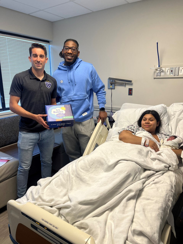 Katia Colin gave birth to baby boy Tee on Fifth Third Day at Baptist Health Louisville. Featured in the photo: Tyler Gibson of the Louisville City Football Club, father Todd Wingate, baby Tee and mother Katia Colin. (Photo: Business Wire)