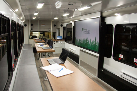 Spanning 36 feet in length, the mobile classroom features workstations for as many as 10 students and multiple instructors, complete with a retractable awning that creates exterior classroom space for as many as 30 additional students. It also comes equipped with power outlets, wireless connectivity, charging stations, pop-up chairs and tables, and sound-amplifying equipment, as well as specialized equipment to make the classroom more accessible. (Photo: Business Wire)