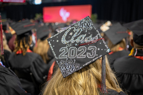 A University of Phoenix graduate looks out over the crowd during the April 29, 2023, commencement ceremony at Chase Field. Photo credit: University of Phoenix.