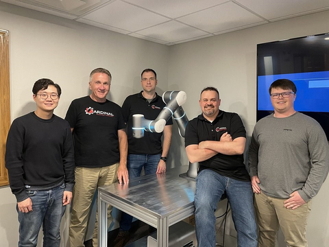 Flexiv's Robotics Application Engineer Dajun Tao (left) meets the Cardinal Machine team. (Photo: Business Wire)
