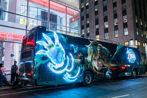 In this photo provided by Nintendo of America, a double-decker bus themed to The Legend of Zelda: Tears of the Kingdom is parked outside of the Nintendo NY store at Rockefeller Plaza to welcome fans to the midnight launch of the game. The Legend of Zelda: Tears of the Kingdom for Nintendo Switch is available now and a direct sequel to The Legend of Zelda: Breath of the Wild, where players decide their own path through the sprawling landscapes of Hyrule and discover new destinations, dangers, sights and puzzles that require wits and resourcefulness to overcome. (Photo: Business Wire)