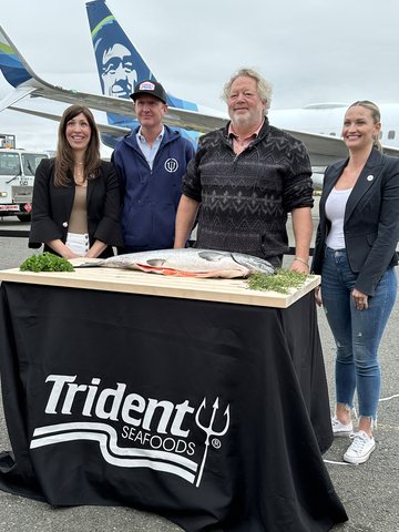 original Trident Seafoods' Ali Turner, Analise Gonzales and Rick Isaacson with Seattle Chef Tom Douglas welcome the first fish from Copper River, kicking-off the Copper River King Salmon Run in front of the Alaska Airlines flight it flew in on, direct Alaska.