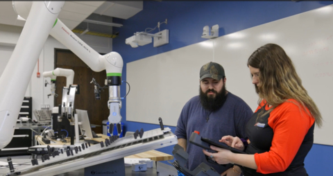 Students at Lorain County Community College learn to program a FANUC CRX Collaborative Robot. FANUC now has 11 cobot model variations that can work in a variety of industrial applications including assembly, inspection, material handling, packaging, palletizing, sanding, welding, and more. (Photo: Business Wire)