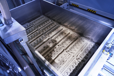 A job box of the ExOne Exerial sand printing system used for serial production at BMW’s Landshut plant. The job box features complex sand cores 3D printed with inorganic binder, which are used to metal cast water jackets for various BMW combustion engines. Courtesy and Copyright, BMW Group.