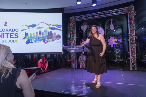 St. Jude survivor Emily welcomes others to the stage during the "Colorado Unites for St. Jude" gala.