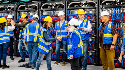 On June 22, 2023, Argonne National Laboratory, Intel and HPE announced that the installation progress of the Aurora Supercomputer is complete. In this photo, the installation team celebrates all 10,624 blades installed together in front of the Aurora Supercomputer. (Credit: Argonne National Laboratory)