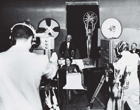 The First Emmy Award: Los Angeles Mayor Fletcher Bowron with an image of the newly created Emmy statuette welcomes attendees and viewers to the first Emmy Awards ceremony, held Jan. 25, 1949, at the Hollywood Athletic Club. (Photo courtesy of the Television Academy)