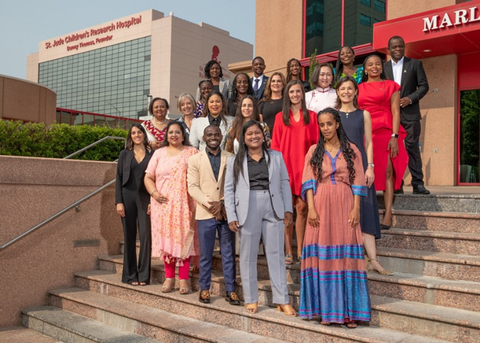 original 2023 ALSAC Global Scholars Program graduates pose on the steps of the Marlo Thomas Center for Global Education and Collaboration on the campus of St. Jude Children’s Research Hospital. (Photo: Business Wire)