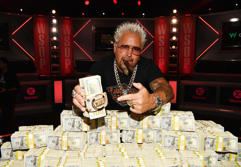 Guy Fieri Poses with 2023 World Series Of Poker® Main Event® Bracelet and Stack of Cash at Horseshoe Las Vegas on July 07, 2023 in Las Vegas, Nevada. (Photo by Denise Truscello/Getty Images for Caesars Entertainment)