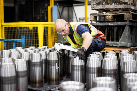 A BAE Systems employee inspects 155mm shell bodies at its production line in Washington, UK. (Photo: Business Wire)
