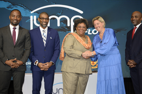 The Hon. Mia Mottley, Prime Minister of Barbados, shakes hands with Inge Smidts, Chief Executive Officer, C&W Communications following the launch of JUMP. They are joined by (from left) The Hon. Kirk Humphrey, Minister of People Empowerment and Elder Affairs; Desron Bynoe, Country Manager, Flow Barbados; and Rodney Taylor, Secretary General, Caribbean Telecommunications Union. (Photo: Business Wire)