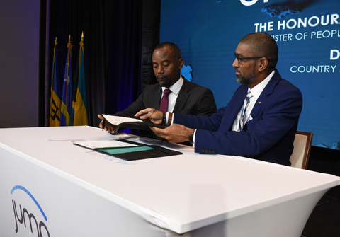 The Hon. Kirk Humphrey, Minister of People Empowerment and Elder Affairs, signs a memorandum of understanding with Desron Bynoe, Country Manager, Flow Barbados to officially launch JUMP in Barbados. (Photo: Business Wire)