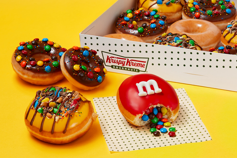 Fans can enjoy four new doughnuts for limited time beginning July 17, including one bursting with M&M’S MINIS Milk Chocolate Candies (Photo: Business Wire)