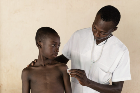 A young boy prepares for vaccination. (Photo: Business Wire)