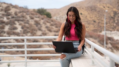 A student uses a laptop between classes. Newegg's Back-to-College and Back-to-School Sales have started. (Photo: Newegg)