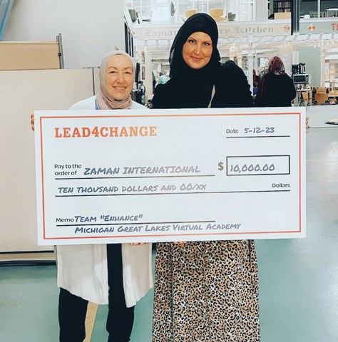 Student advisor Danielle Stoops, pictured on the right, presents the award to Zaman International founder Najah Bazzy, pictured on the left. (Photo: Danielle Stoops, teacher, MGLVA)