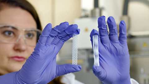 thumbnail Nicole Black, Ph.D., VP of Biomaterials and Innovation at Desktop Health, examines two tubular medical devices printed on the new 3D-Bioplotter® PrintRoll™ rotating build platform in medical-grade materials. PrintRoll is designed to enable new medical solutions for the body’s thousands of miles of internal channels, such as vascular, digestive, and other systems. (Photo: Business Wire)