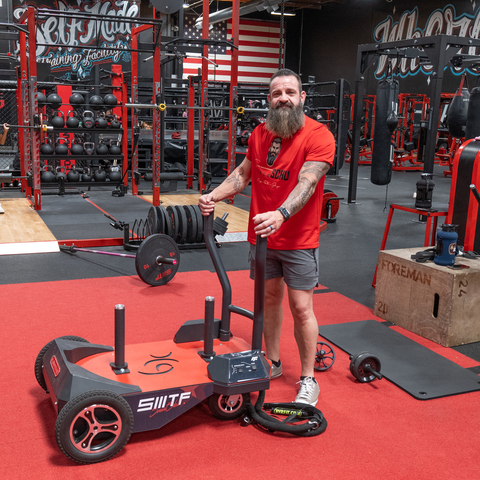 Brian Schumaker (Coach Schu) poses with BodyKore's Smart Sled Pro, which he often uses to train youth athletes at Self Made Training Facility HQ in Temecula, CA. (Photo: Business Wire)
