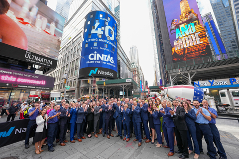 Cintas employee partners celebrating their 40th anniversary of going public and being listed on the Nasdaq exchange in Times Square. (Photo Credit: Nasdaq, Inc./ Vanja Savic)