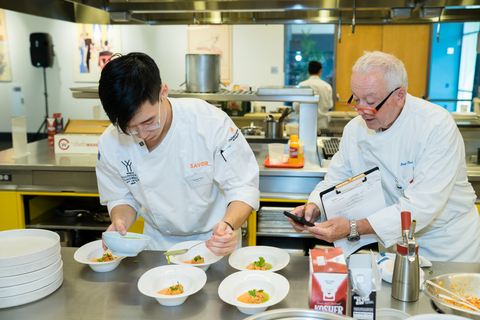 Judge/Chef Roland Passot (right) evaluates contestant Marcus Youn during the chef competition of Young Chef Young Waiter USA on Aug. 21, 2023, at the CIA at Copia. Youn would go on to win first place in the competition and heads to Monaco to compete in the world finals in November. (Photo: Andreas Zhou/SAVOR)