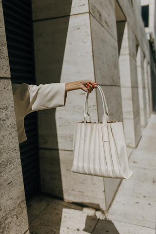The Elizabeth Damrich x Antonio Melani Pleated Tote is available exclusively at Dillard's. (Photo: Business Wire)