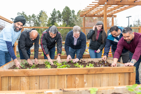 CEO, Venkat Kavarthapu and other Edifecs leaders and employees work in the communal garden - created for the entire community (Photo: Business Wire)