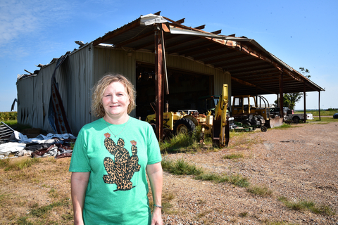 Merrie Butler with Martin Farms in Silver City, Mississippi, said a spring tornado caused extensive damage to the farm, including to the shop in the background. The Federal Home Loan Bank of Dallas and BankPlus provided a $20,000 grant for farm repairs. (Photo: Business Wire)