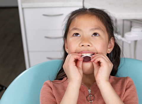 Dr. Sandra Tai’s patient independently inserting Invisalign® Palatal Expander. (Photo: Business Wire)